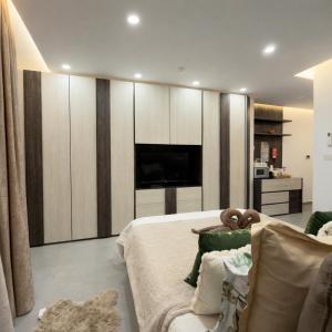 a bedroom with a large bed and a couch at Moonlit Terrace Escape in St. Paul's Bay +45 photos