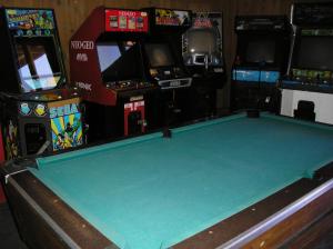 a pool table in a room with arcade machines at Lake of the Springs Camping Resort Cabin 1 in Oregon House