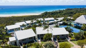 an aerial view of a house and the beach at Jara - U19 Pandanus Palms Resort in Point Lookout