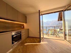 a kitchen with a view of a balcony at Il Bellavista in Lezzeno