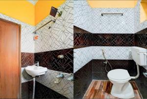 a bathroom with a toilet and a sink at KVS Residency in Tiruvallam