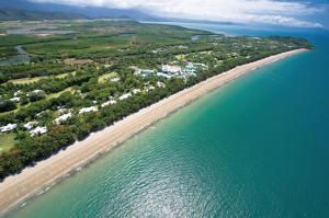 an aerial view of a beach and the ocean at Reef Resort Villas Port Douglas in Port Douglas
