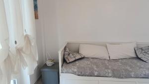 a bed with two pillows on it in a room at CasAmare in Montesilvano