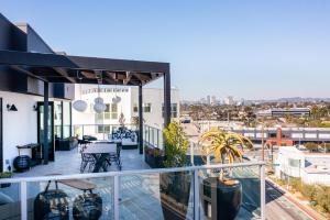 an apartment balcony with a view of the city at The Shay, a Destination by Hyatt in Los Angeles