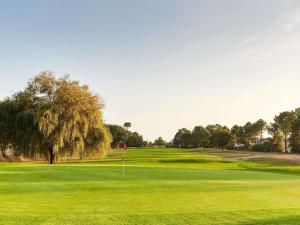 a view of a golf course with a green at ibis Styles St Gilles Croix de Vie centre-ville in Saint-Gilles-Croix-de-Vie