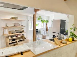 a kitchen with a counter top and a refrigerator at SEABASE villa at shimane in Matsue +45 photos