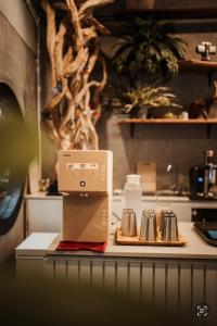 a box sitting on top of a counter in a kitchen at Beanstay hostel in Phuket +15 photos