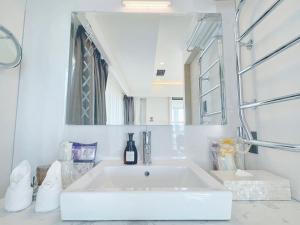 a white bathroom with a sink and a mirror at BREATH HOTEL in Fujisawa +42 photos