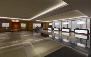 a lobby with a row of tables in a building at Hyatt Regency McCormick Place Chicago in Chicago