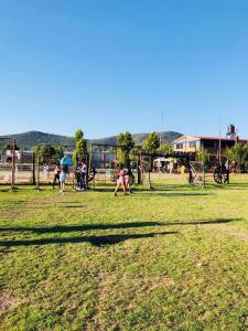a group of people playing in a park at Casa Jardín Santiago in Texcoco de Mora