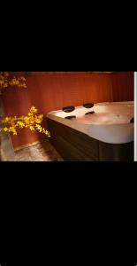 a bathroom with a white counter and a sink at Nuit au Ranch Horse Paradise & Jacuzzi in Boutigny-sur-Essonnes +31 photos