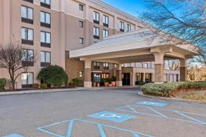 a hotel parking lot with handicapped signs in front of a building at Comfort Inn & Suites Somerset - New Brunswick in Somerset