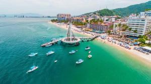 an aerial view of a beach with boats in the water at Freya studio III Romantic Zone in Puerto Vallarta