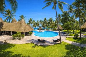 an aerial view of a resort pool with palm trees at Diamonds Malindi in Malindi