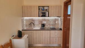 a kitchen with a sink and a counter top at Filippos Apartments "Room 5" in Spartià