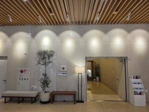 a lobby with a couch and a table in a building at SL Hotel Myeongdong in Seoul