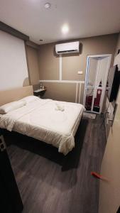 a bedroom with a large bed in a room at C&CDreamland hotel in Ipoh