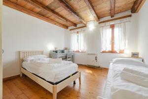 Casa Maria - Longarone Fiera e Vajont & Wi-Fi tesisinde bir odada yatak veya yataklar