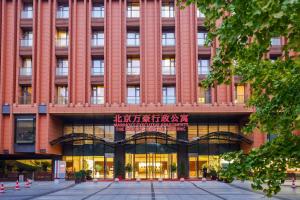 a large red building with a sign in front of it at The Imperial Mansion, Beijing - Marriott Executive Apartments in Beijing