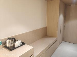 a kitchen with a counter with pots and pans at Shagun Hotel & Resorts in Khandwa +1 photo