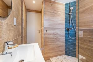 a bathroom with a shower with a sink and a toilet at "La Sorra" Résidence en Bord de mer in Saint-Cyprien +47 photos