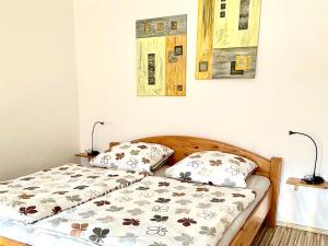 a bed in a room with two pillows on it at Ferienwohnung in der Seestraße in Sassnitz