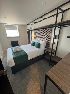 a bedroom with a bunk bed with a ladder at Glass Tower - By Central Beach Leisure in Blackpool +2 photos