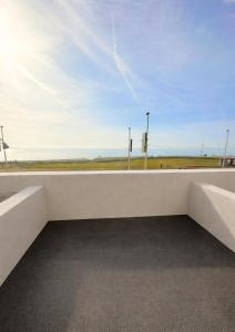 a view of the ocean from a building balcony at Glass Tower - By Central Beach Leisure in Blackpool