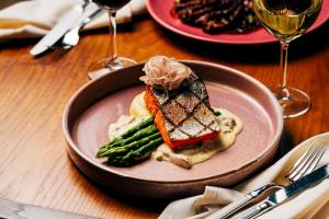 a plate of food with a sandwich on a table at Solo Sokos Hotel Torni Helsinki in Helsinki +41 photos