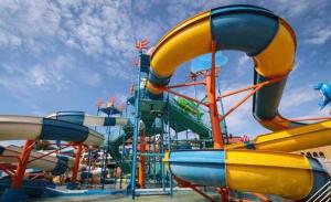 a water park with a colorful water slide at Homestay Santai Bertam in Kepala Batas