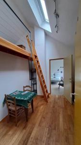 a room with a table and a staircase in a house at Au Grand Babin - Namur in Namur