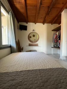 a bedroom with a large bed in a room at Ninemo Residences Skiathos in Achladies