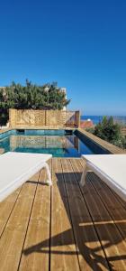 a view of a swimming pool from the deck of a house at Residence Mara Dea in Galeria