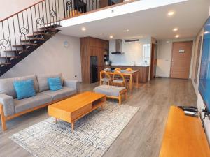 a living room with a couch and a table at Westlake view Duplex Studio in Hanoi