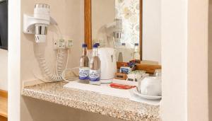 a kitchen counter with a counter top with some items on it at The Brae Hotel in Brae +30 photos
