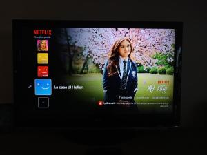 a television screen with a picture of a woman at La Casa di Hellen 2room &living room 5pers app in Saronno