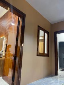 a bathroom with a shower and a mirror at Sun Homestay Doclet in Doc Let