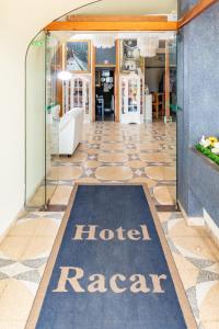a hotel raaz sign on the floor of a lobby at Racar Hotel in Frigole +53 photos