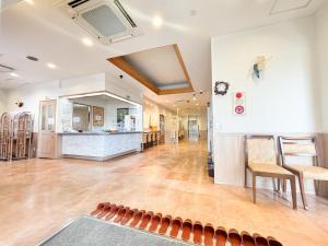 an empty room with a bar in a building at Hotel Livemax Tagajo in Tagajo +49 photos