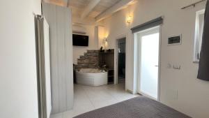 a bathroom with a sink and a bath tub at Residenza Montegrappa in Peschici +52 photos