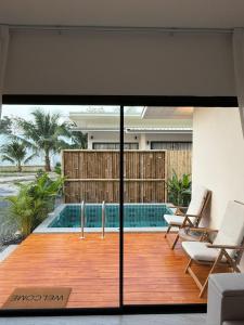 a view of a swimming pool from a house at Srithanu Escape 2 in Srithanu