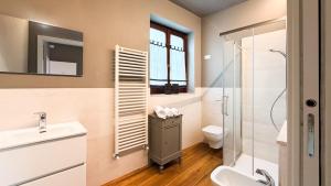 a bathroom with a shower and a toilet and a sink at Alloggi Nell's in Cornedo Vicentino +12 photos