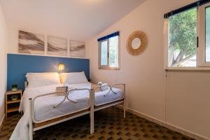 a bedroom with a bed and a window at Club del Sole Roseto degli Abruzzi Easy Camping Village in Roseto degli Abruzzi +94 photos