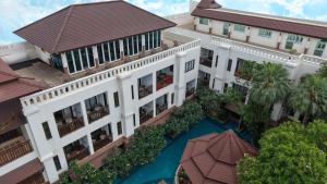an overhead view of a building with a swimming pool at Quality Beach Resorts and Spa Patong in Patong Beach