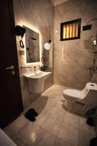 a bathroom with a sink and a toilet at شقة vip غرفتين نوم in Jeddah +6 photos
