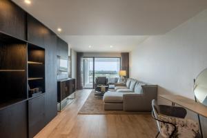 a living room with a couch and a table at Hotel SB BCN Events 4* Sup in Castelldefels