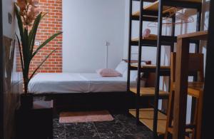 a bedroom with a bunk bed in a room at Complexe Smile & Be in Yaoundé