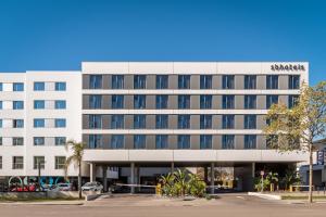 a large white building with a sign on it at Hotel SB BCN Events 4* Sup in Castelldefels