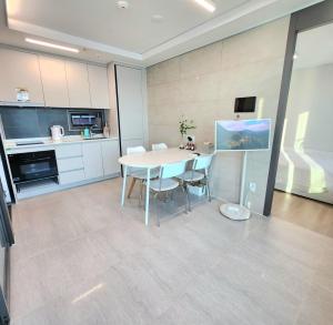 a kitchen and dining room with a table and chairs at Busan#Gwanganli#Hot place#Healing Home in Busan