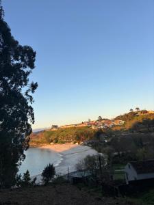 a view of a beach from a hill at La casita in Pontevedra